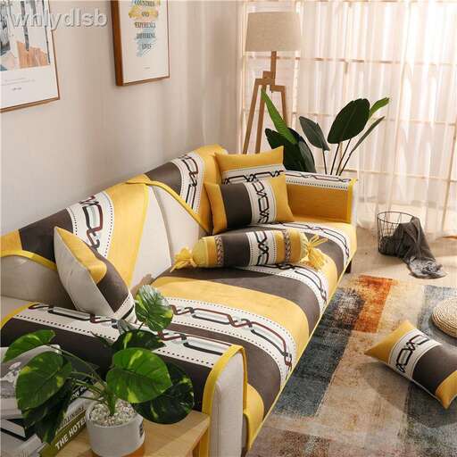a yellow and white living room with a couch and a plant