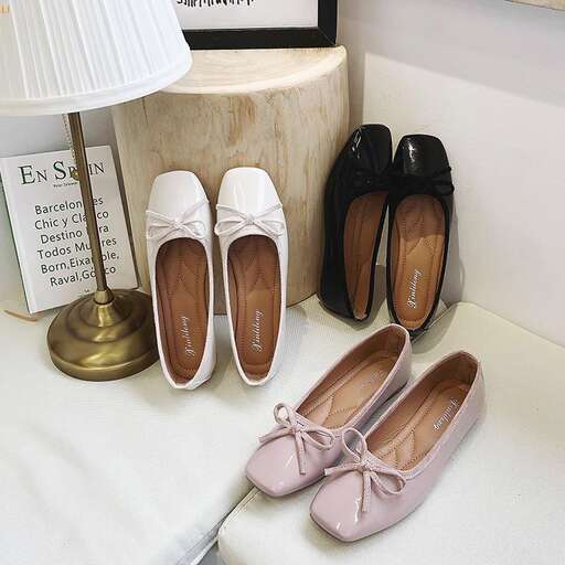 a pair of shoes and a lamp on a table.