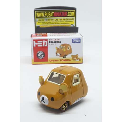 a car with a dog in it's mouth