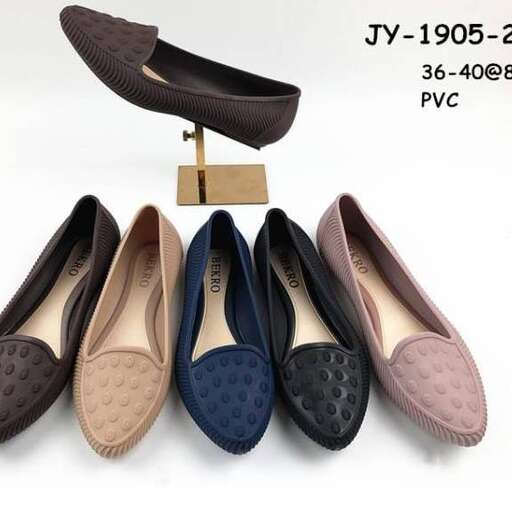 a pair of shoes with a wooden stand.