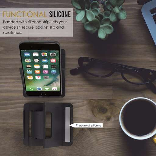 a tablet and a cup of coffee on a table.