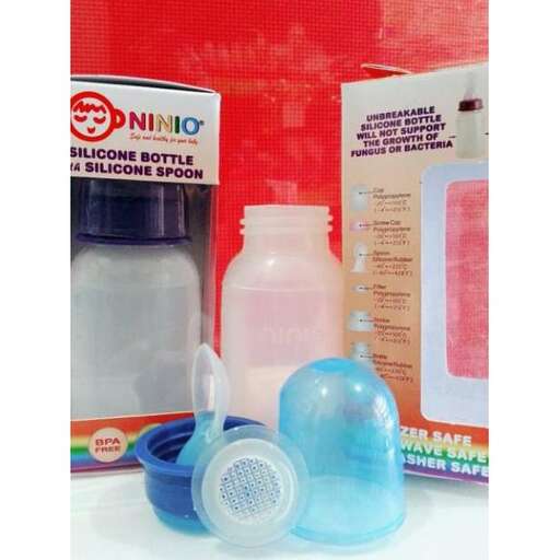 a bottle of baby care products on a table.