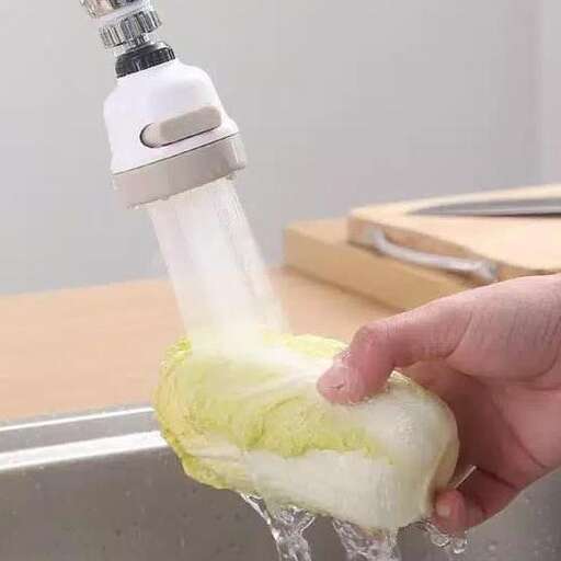 a person is washing a banana in a sink