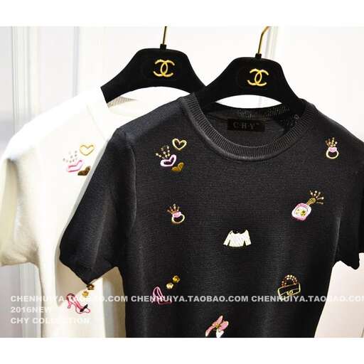 black and white t - shirt with a cute design.
