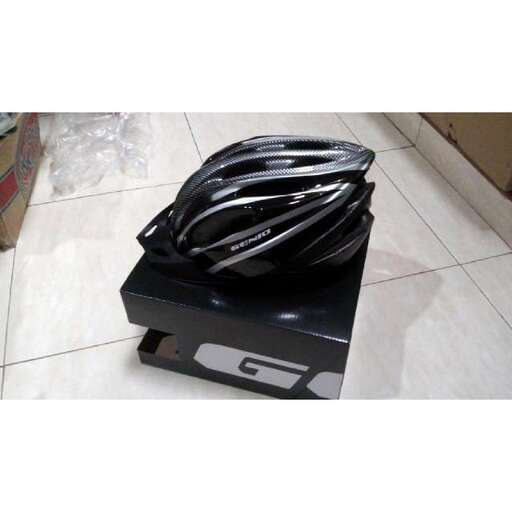a black helmet sitting on top of a box.