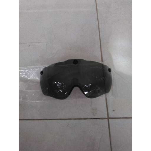 a pair of goggles sitting on a tile floor.