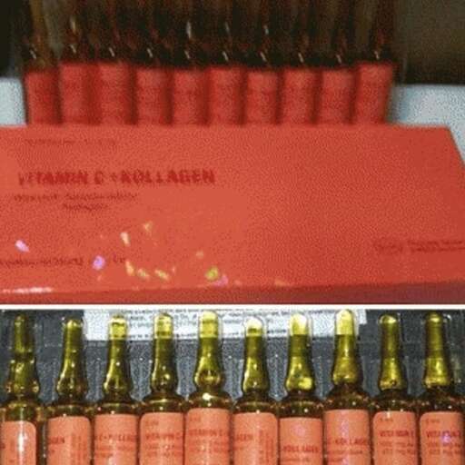 a display case with bottles of wine and a red envelope.