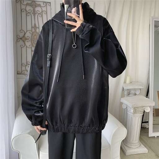 a person in a black jacket and pants