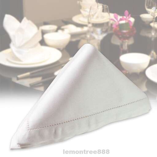 a table with a table setting with plates and napkins.