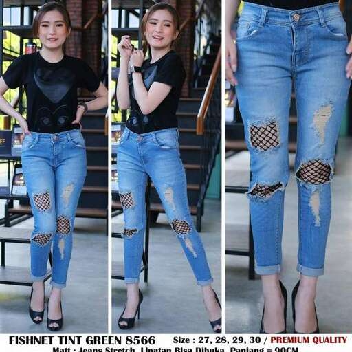 a model in a black t - shirt and jeans