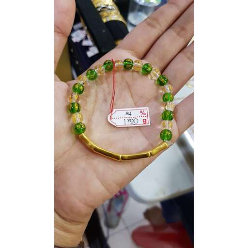 a bracelet made of green glass beads.