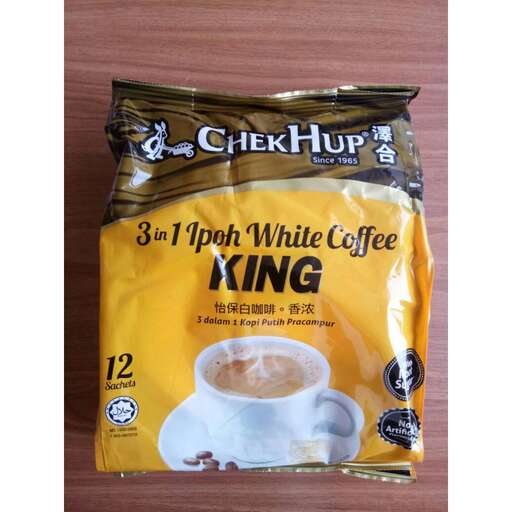 a bag of coffee with a white cup of coffee