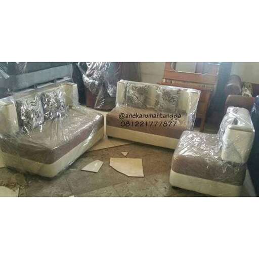 a couch with a lot of pillows on it.