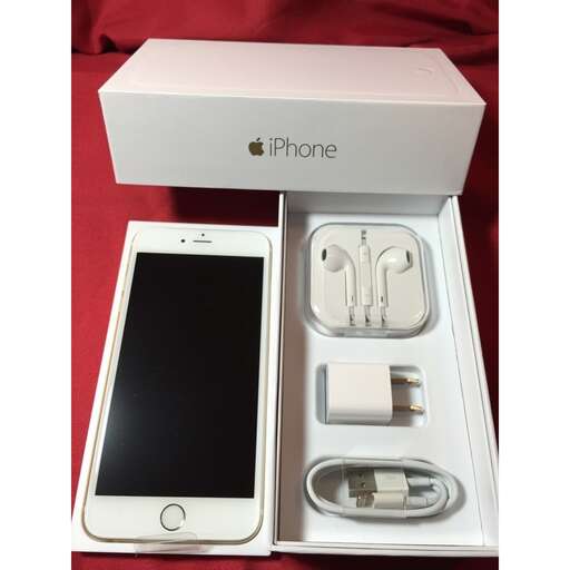 a box with a white iphone inside of it.
