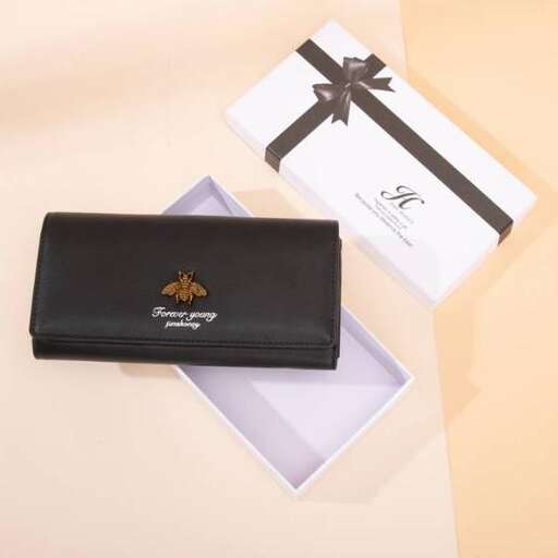 a black wallet on a white table