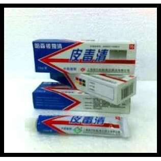 two pack of cigarettes sitting on top of a white wall.