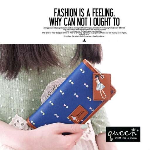 a girl holding a purse with a picture of a girl.