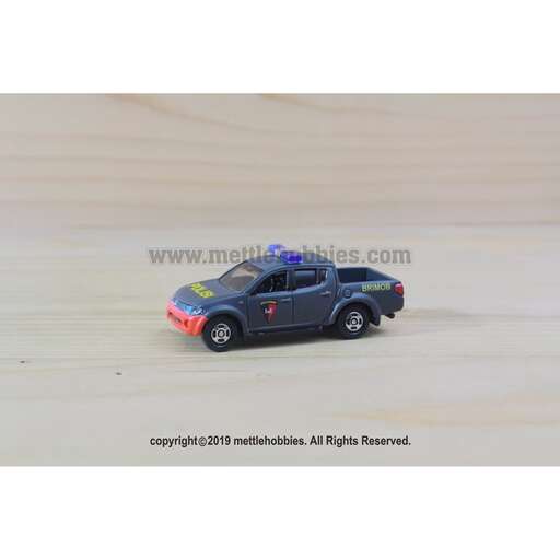 a toy car in the sand