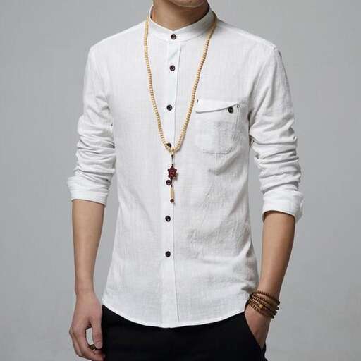 a white shirt with a gold necklace