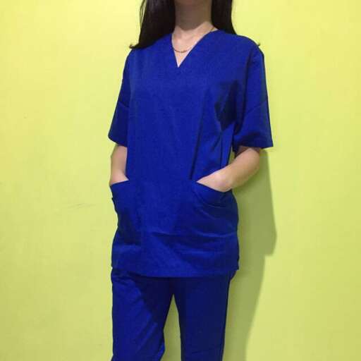 the nurse in blue scrubs