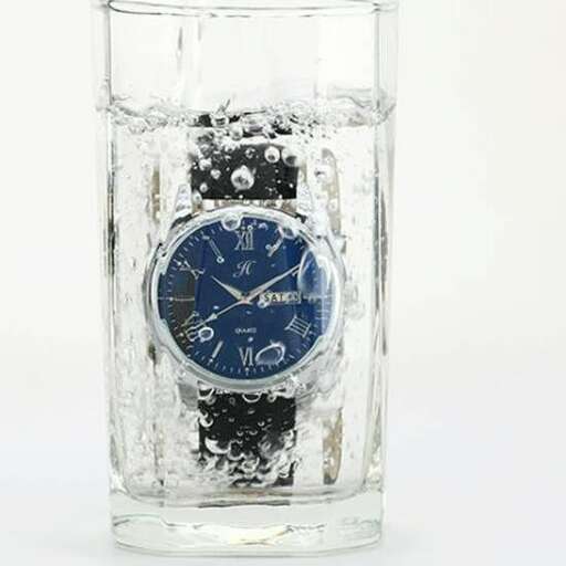 a glass of water with a clock in it.