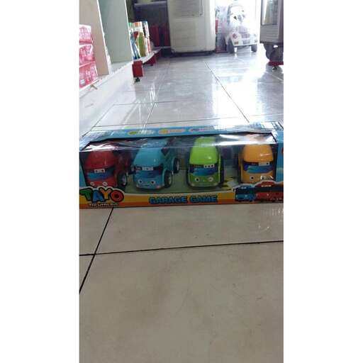 a box with a toy truck inside of it.
