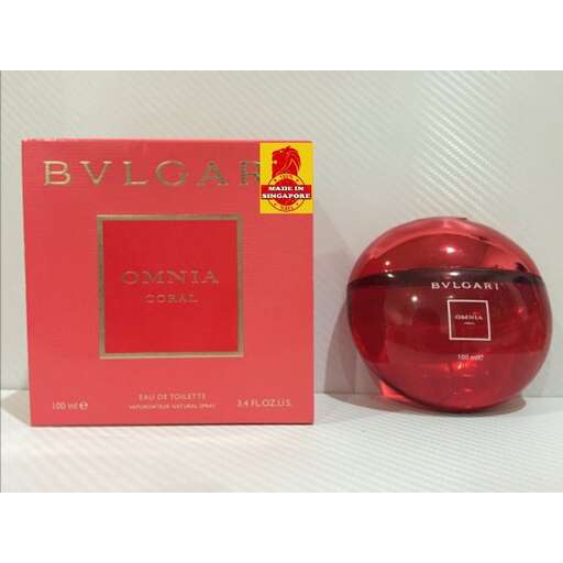 a red glass perfume bottle in a box
