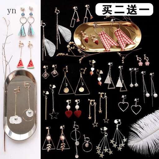 a skateboard and a pair of earrings are shown.