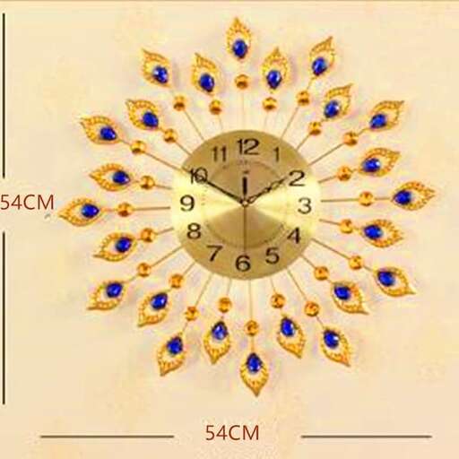 a clock with a gold face and blue diamonds.