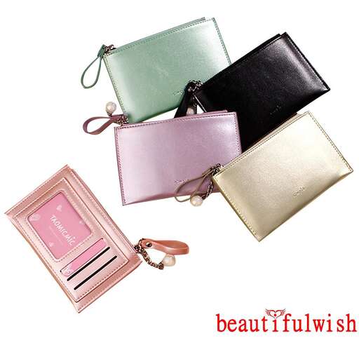 a pink and black purse with a pink purse on it.