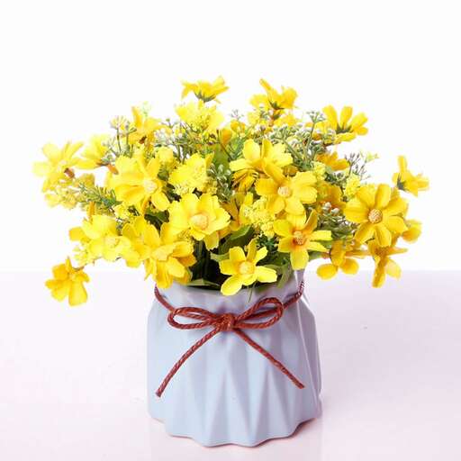 a bouquet of yellow flowers in a blue vase.