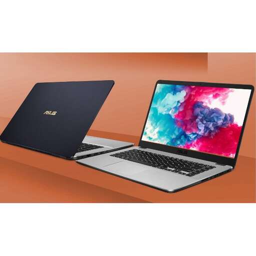 a laptop computer with a colorful display on a wooden desk.