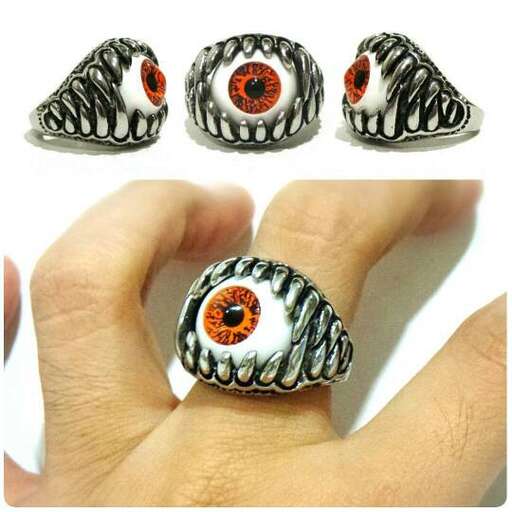 a ring made of orange and black beads.