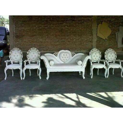 a wall of chairs in a garage