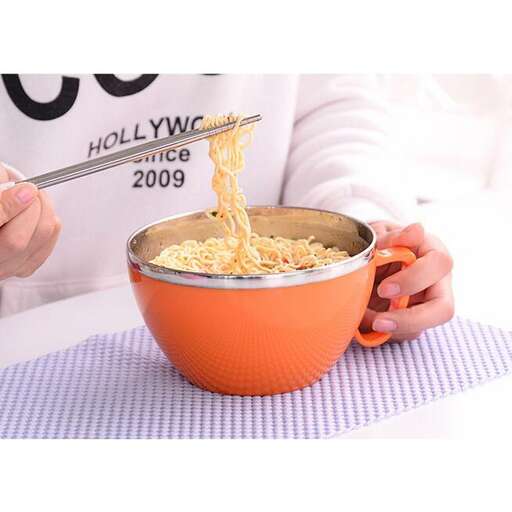 a person is stirring a bowl of food.