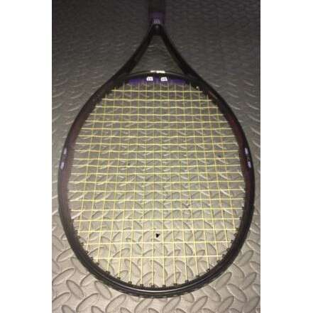 a tennis racket with a meshed surface.