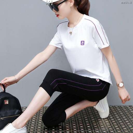 a white t - shirt with a pink collar and black pants