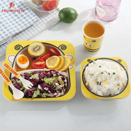 a yellow tray with a bowl of salad and a glass of orange juice.