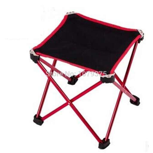 a large folding chair with a red frame.