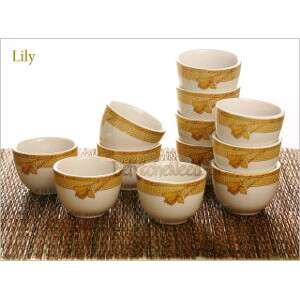 a set of bowls and cups on a table.