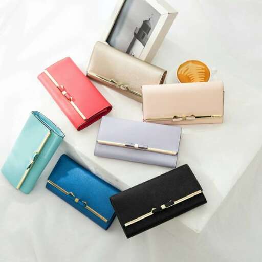 a collection of colorful wallets on a white surface.