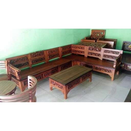 a large wooden bench sitting in a room.