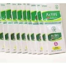 a box of green and white boxes in a row.