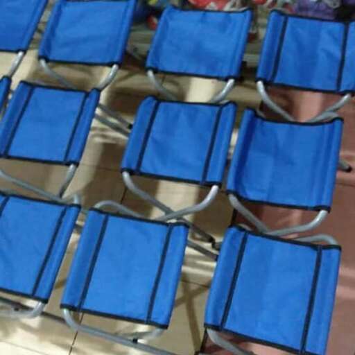 a set of chairs with a blue cushion.