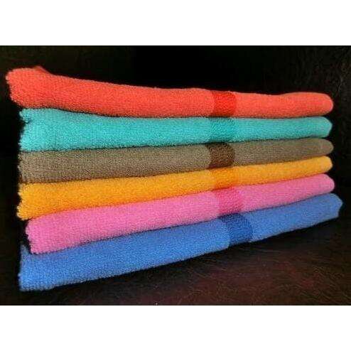a stack of towels that are lined up.