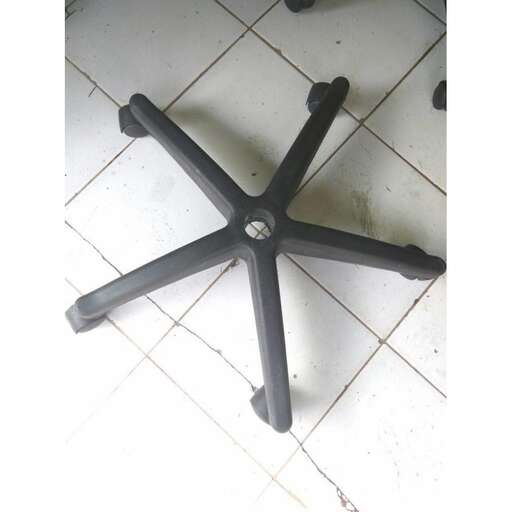 a chair with a metal base and a round base.