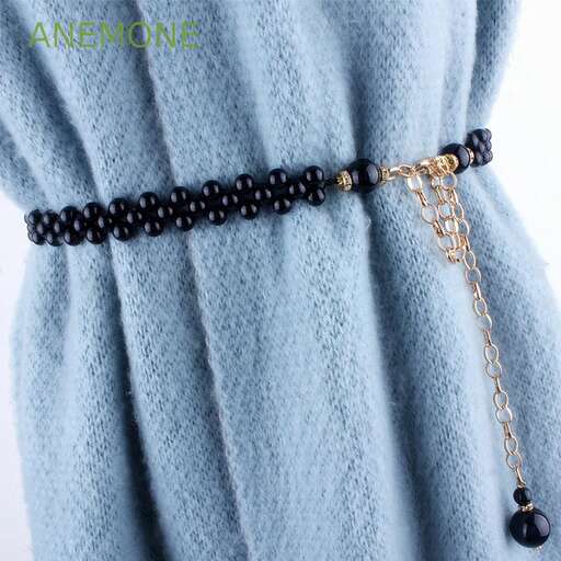 black and white beaded necklace with black and white beads and a black beaded chain.