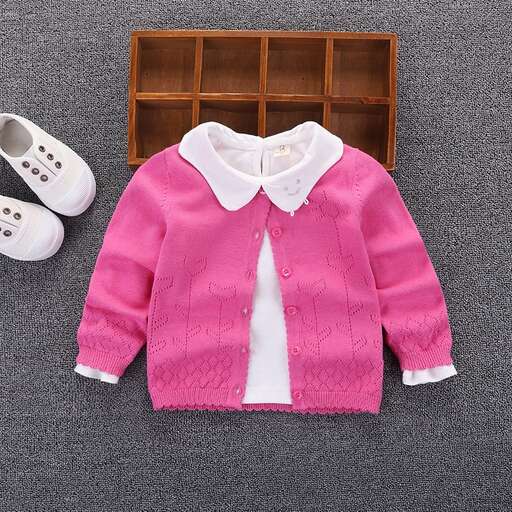 a little boy's sweater with a bow tie