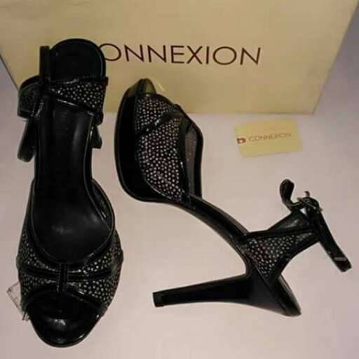 a pair of black shoes with a small heel.