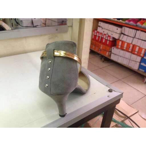a pair of gold wedding rings on a table.